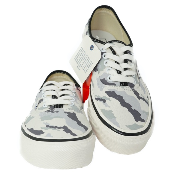 white and grey camo vans